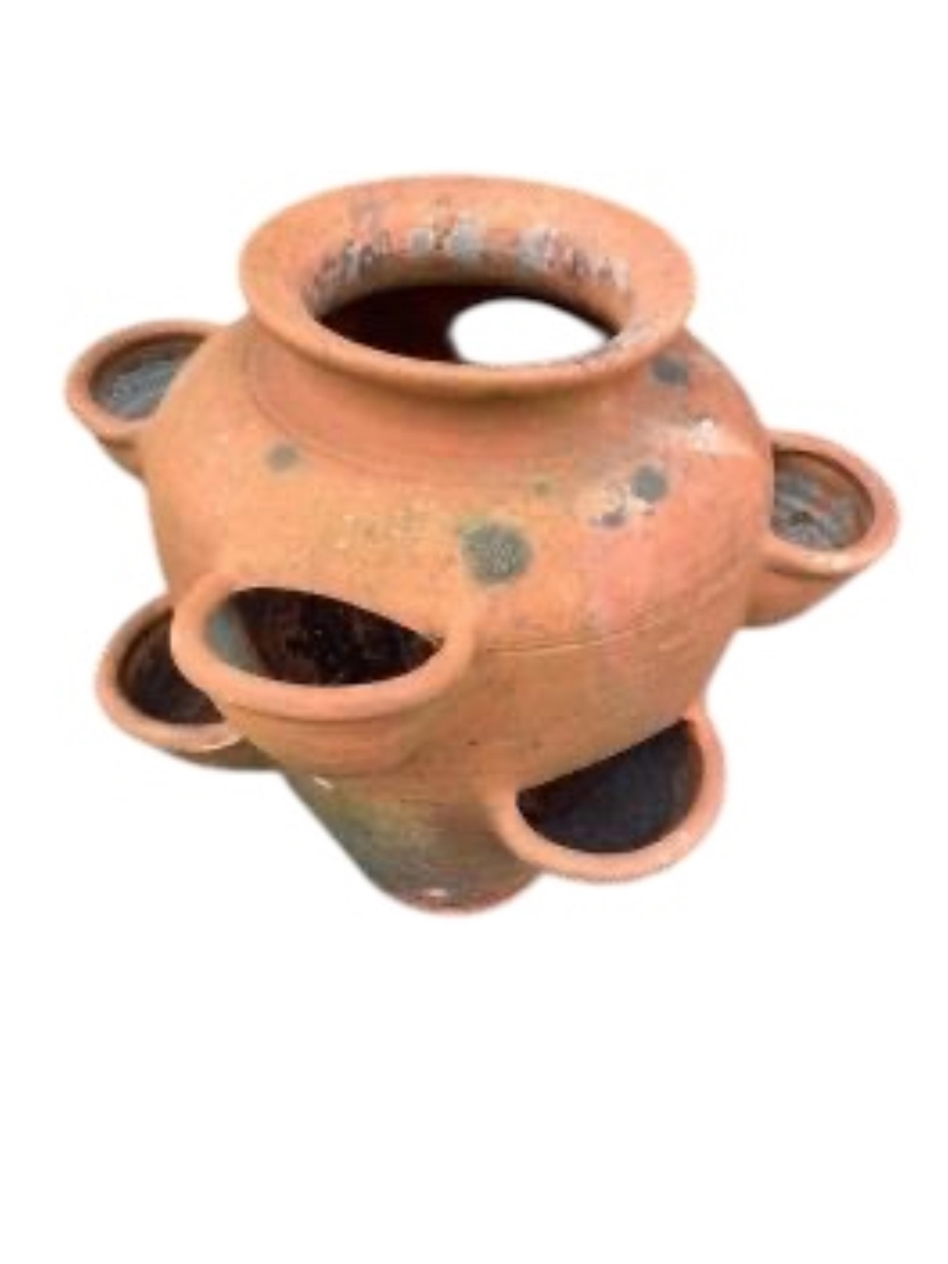 A terracotta strawberry planter and two other planters, largest height 39cm